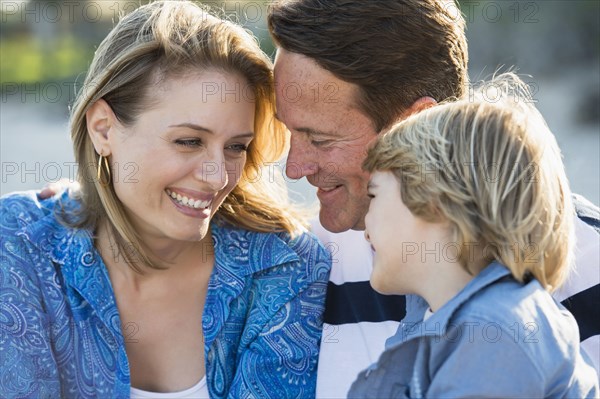 Family smiling together outdoors