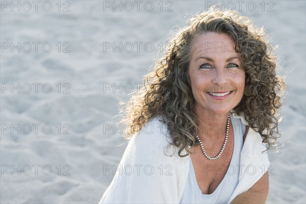 Caucasian woman smiling on beach