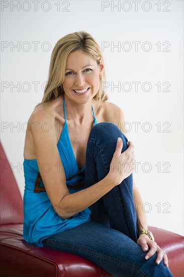 Caucasian woman smiling in chair