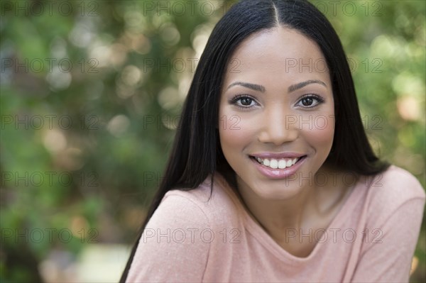 Hispanic woman smiling outdoors