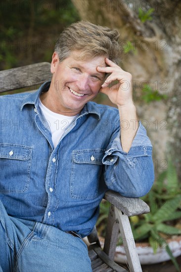 Caucasian man sitting outdoors