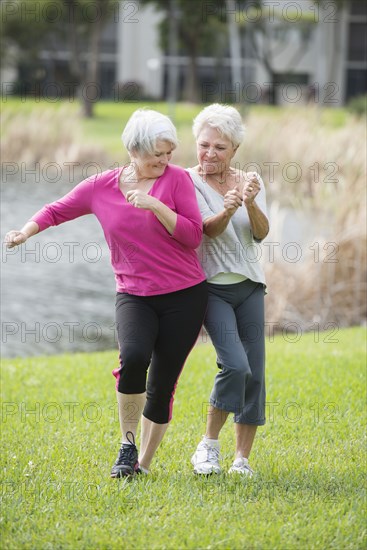 Senior Caucasian women playing in park