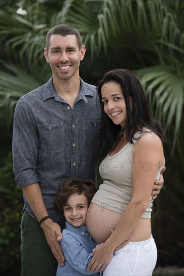 Family smiling together outdoors