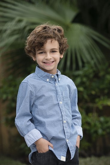 Mixed race boy smiling outdoors