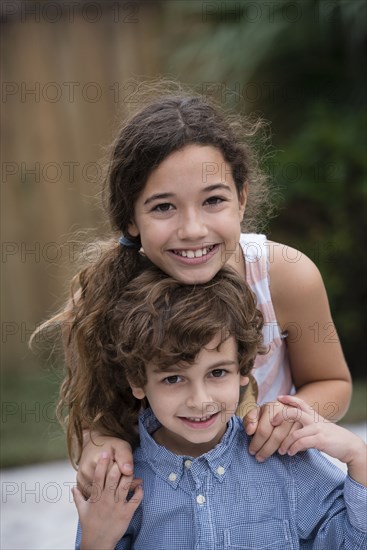 Mixed race children smiling together
