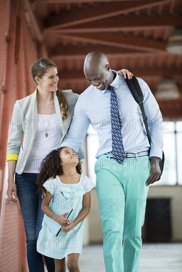 Family walking together on walkway