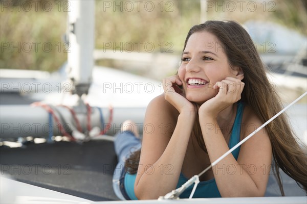 Caucasian woman laying outdoors