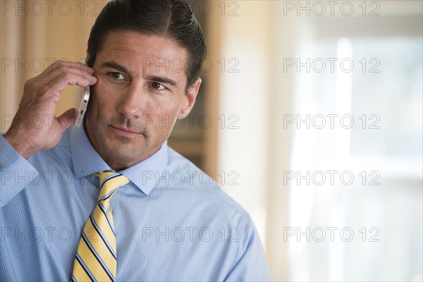 Caucasian businessman talking on cell phone