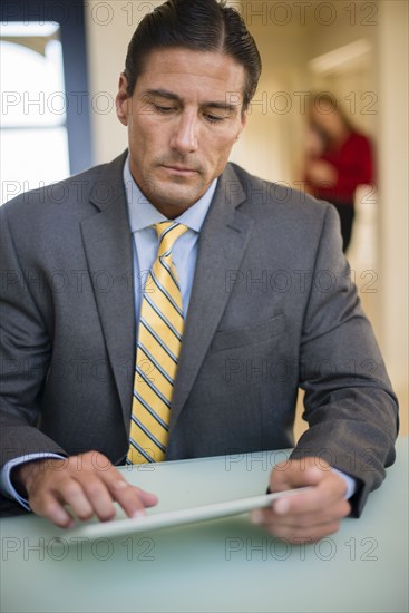 Caucasian businessman using digital tablet