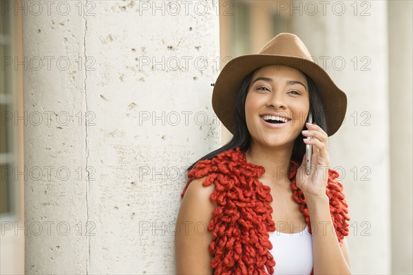 Black woman talking on cell phone outdoors