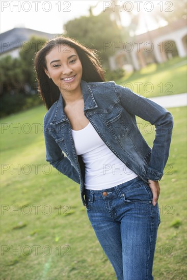 Black woman walking on lawn