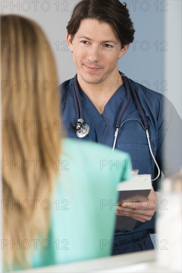 Doctor listening to patient