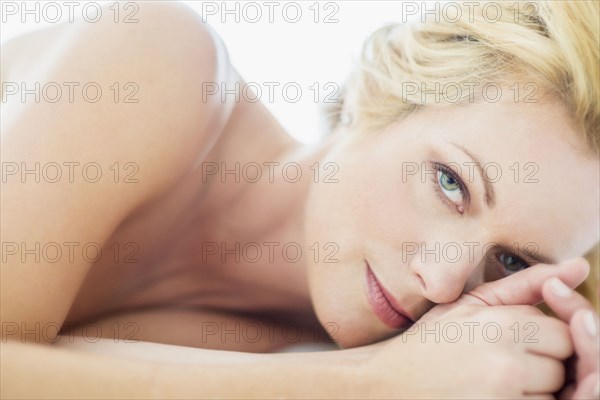 Close up of smiling Caucasian woman laying down