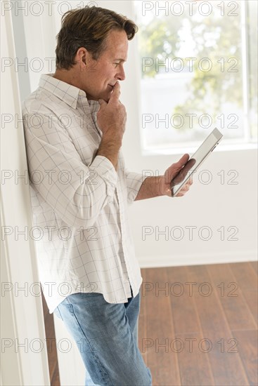 Caucasian man using digital tablet