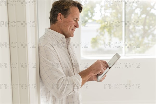 Caucasian man using digital tablet