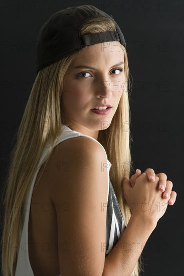 Serious Caucasian woman looking over her shoulder