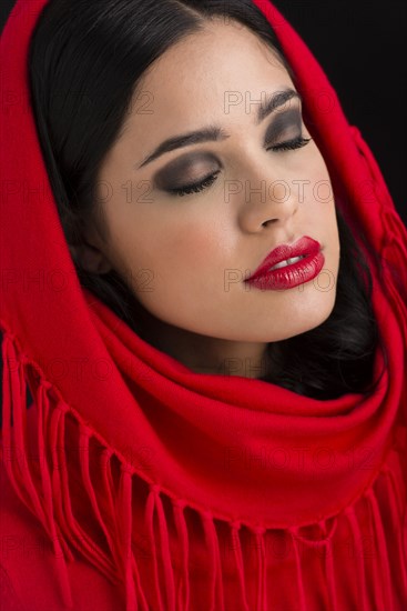 Glamorous Hispanic woman wearing headscarf