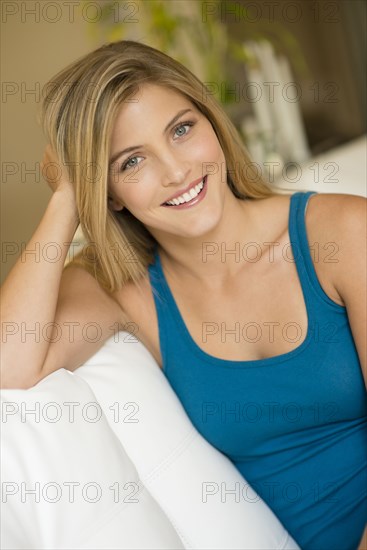 Caucasian woman sitting on sofa