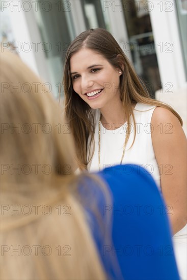 Caucasian women sitting outdoors