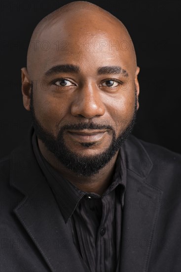 Close up of black businessman smiling