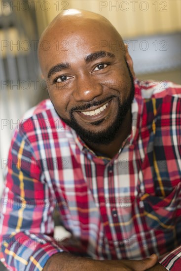 Black man sitting on stairs