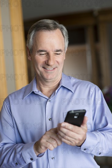 Caucasian businessman using cell phone