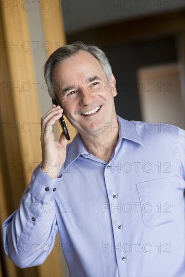 Caucasian businessman talking on cell phone