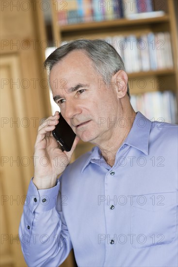 Caucasian businessman talking on cell phone