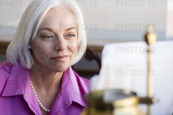 Caucasian businesswoman working at office desk