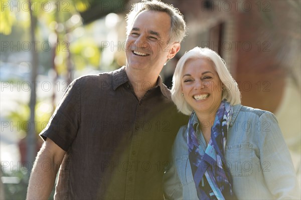 Older Caucasian couple walking outdoors