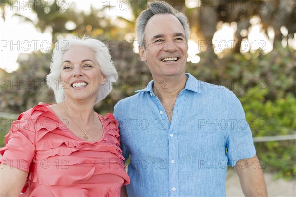 Close up of older Caucasian couple hugging