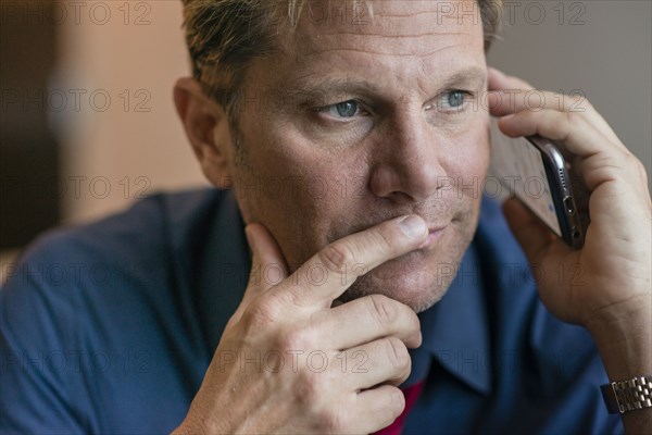 Caucasian businessman talking on cell phone