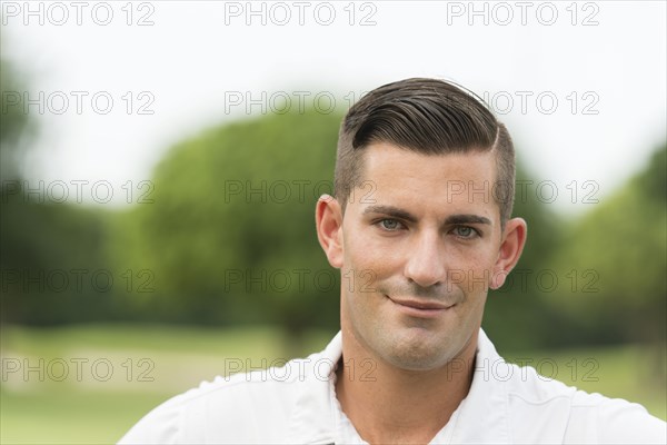 Close up of Caucasian man smiling outdoors