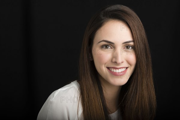 Close up of Hispanic woman smiling