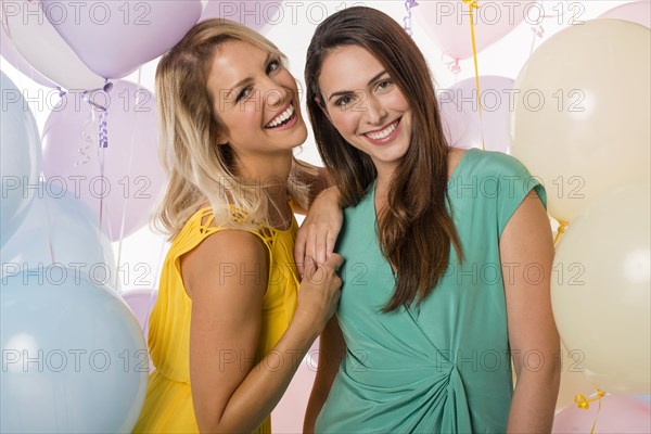Women smiling with balloons