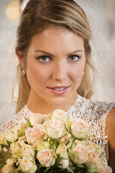 Close up of bride holding bouquet of flowers