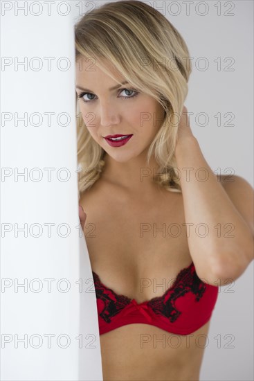 Sultry Caucasian woman wearing red bra