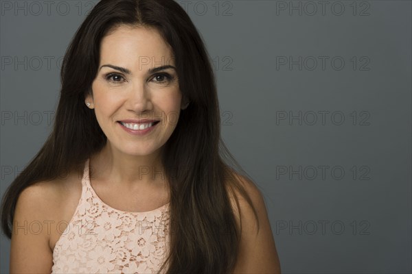 Close up of Hispanic woman smiling