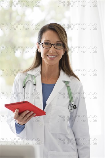 Caucasian doctor using digital tablet