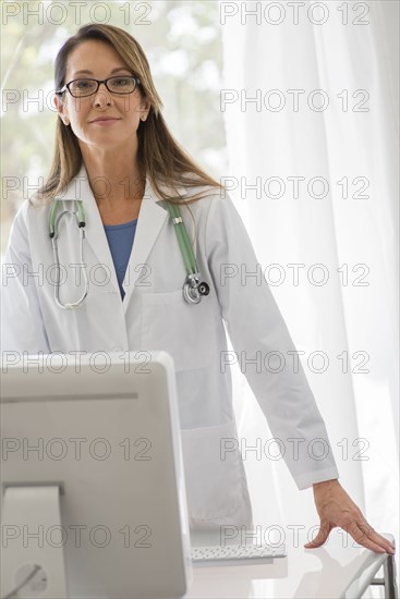 Caucasian doctor using computer