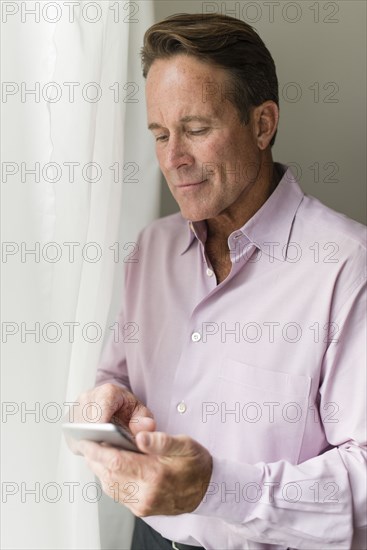 Caucasian businessman using cell phone