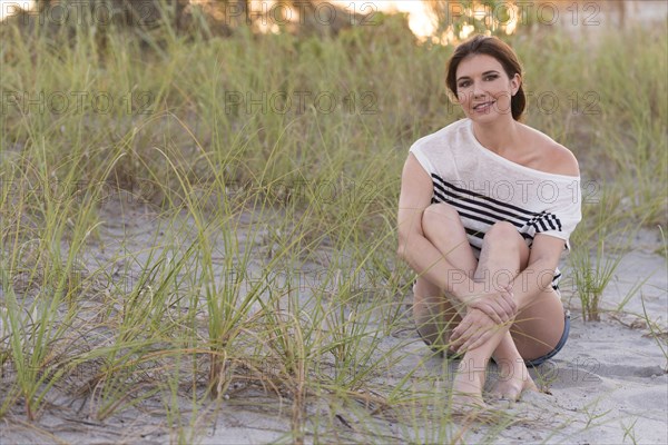 Caucasian woman smiling on beach