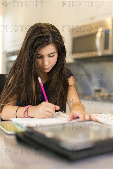 Mixed race girl doing homework