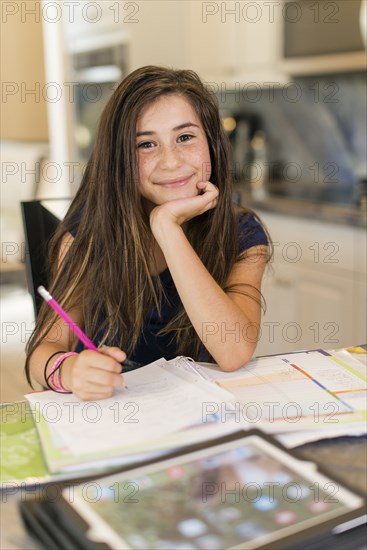 Mixed race girl doing homework