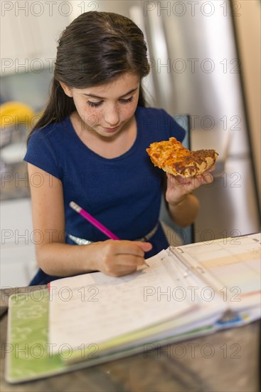 Mixed race girl doing homework