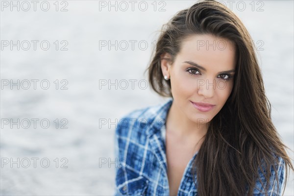 Hispanic woman smiling outdoors