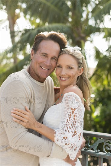 Caucasian couple hugging outdoors