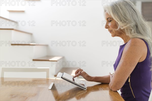 Caucasian woman using digital tablet