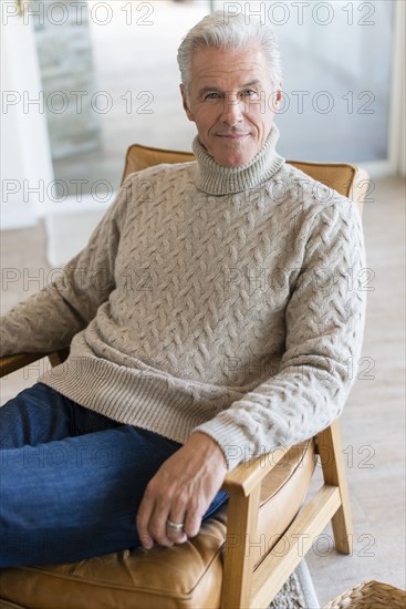 Caucasian man sitting in armchair