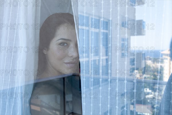 Woman looking out window